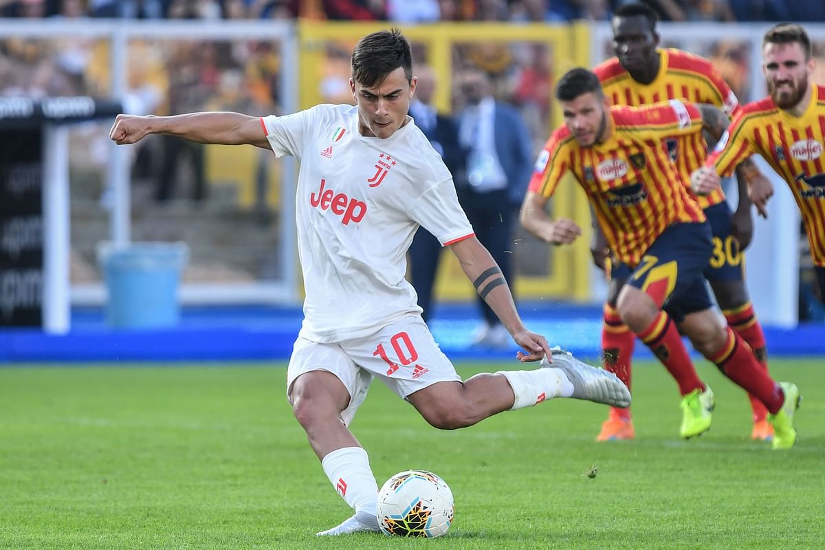 Juventus` Argentine forward Paulo Dybala shoots to score a penalty and open the scoring during the Italian Serie A football match Lecce vs Juventus on Saturday at the Stadio Comunlae Via del Mare in Lecce. Photo: AFP