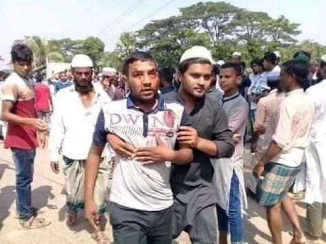 A person is being taken away after he receives injuries in a clash with the members of law enforcers at Borhanuddin in Bhola on 20 October. Photo: Prothom Alo