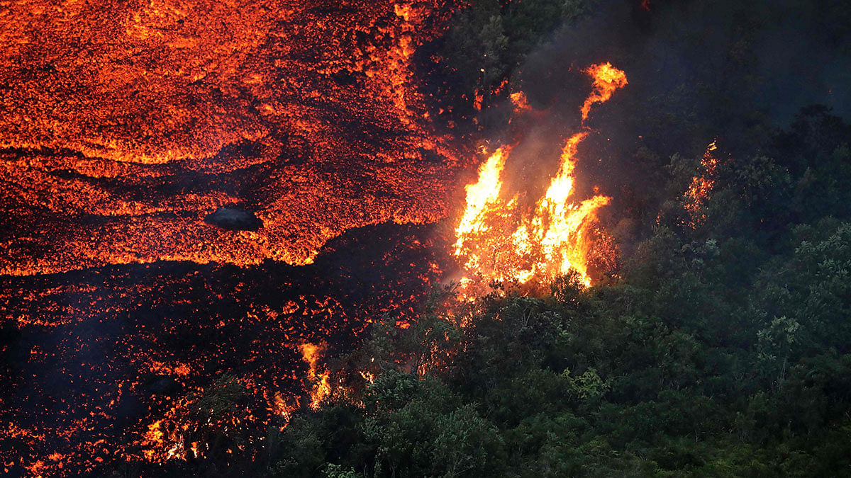 This picture taken on 25 October 2019 shows lava from the Piton de la Fournaise (`Peak of the Furnace`) flowing down the east-south-east face on the Indian Ocean island of Reunion. Photo: AFP