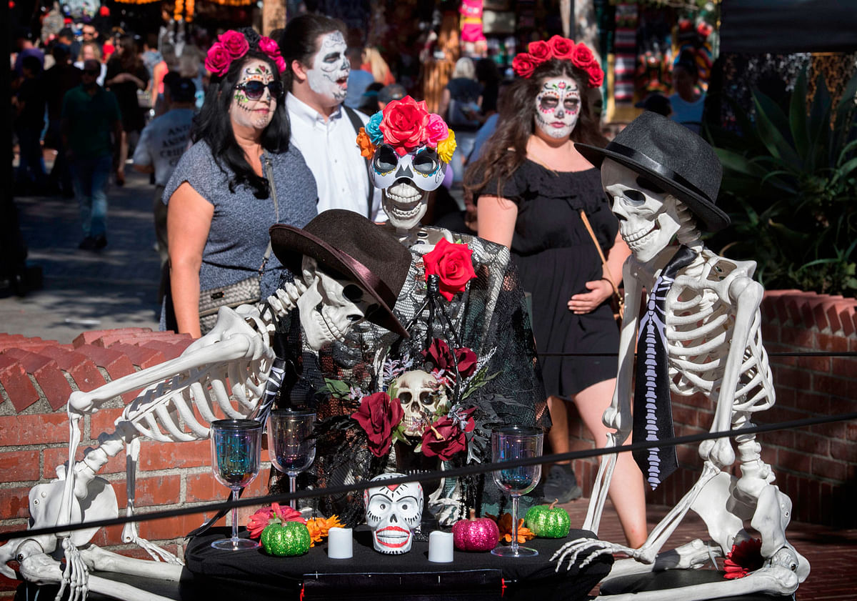 People view the displays during the Dia De Muertos (Day of the Dead) celebration in Los Angeles on 26 October, 2019. Photo: AFP