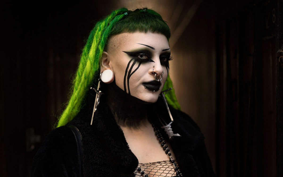 A participant in costume attends the biannual `Whitby Goth Weekend` festival in Whitby, northern England, on 27 October, 2019. Photo: AFP
