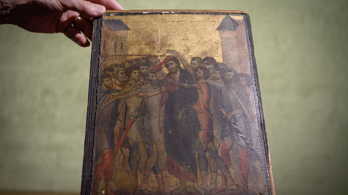 This file photo taken on 23 September 2019, shows a painting entitled `the Mocking of Christ` by the late 13th century Florentine artist Cenni di Pepo also known as Cimabue. AFP File Photo