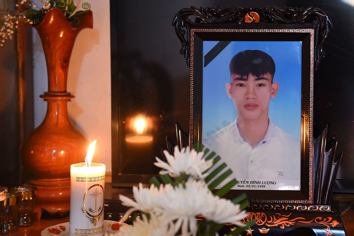 A portrait of 20-year-old Nguyen Dinh Luong, who is feared to be among the 39 people found dead in a truck in Britain, is kept on a prayer altar at his house in Vietnam`s Ha Tinh province on 29 October 2019. Photo: AFP