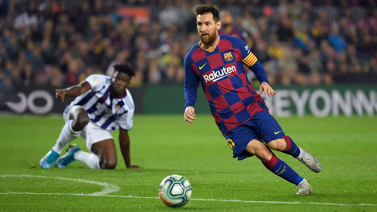 Barcelona`s Argentine forward Lionel Messi dribbles the ball during the Spanish league football match between FC Barcelona and Real Valladolid FC at the Camp Nou stadium in Barcelona on Tuesday. Photo: AFP