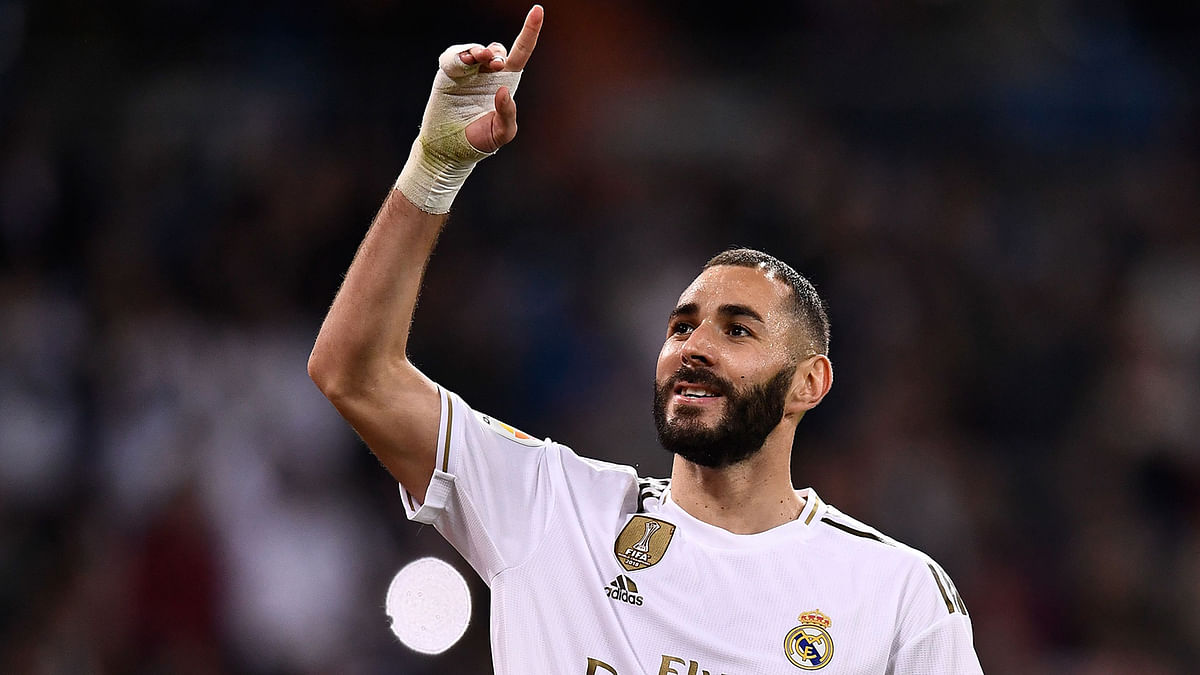 Real Madrid`s French forward Karim Benzema celebrates after scoring a goal during the Spanish league football match between Real Madrid CF and Club Deportivo Leganes SAD at the Santiago Bernabeu stadium in Madrid on Wednesday. Photo: AFP