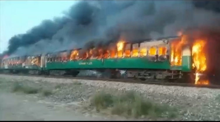 A fire burns a train carriage after a gas canister passengers were using to cook breakfast exploded, near the town of Rahim Yar Khan in the south of Punjab province, Pakistan on 31 October 2019, in this still image take from video. Photo: Reuters