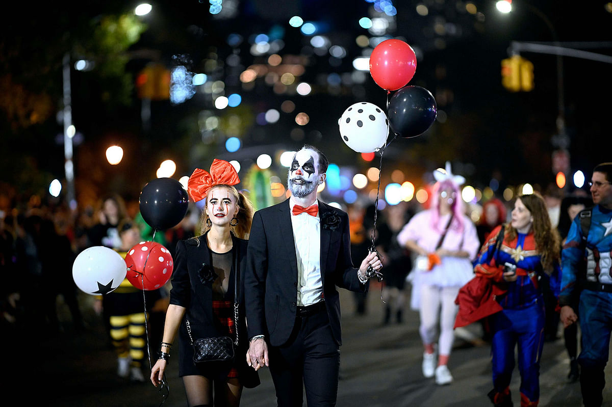 People in costumes participate in the annual Village Halloween parade on Sixth Avenue on 31 October in New York. Photo: AFP
