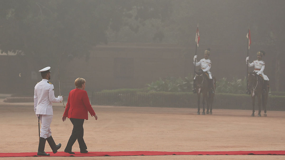 German Chancellor Angela Merkel inspects an honour guard during her ceremonial reception at the forecourt of India`s Rashtrapati Bhavan presidential palace in New Delhi. Photo: Reuters
