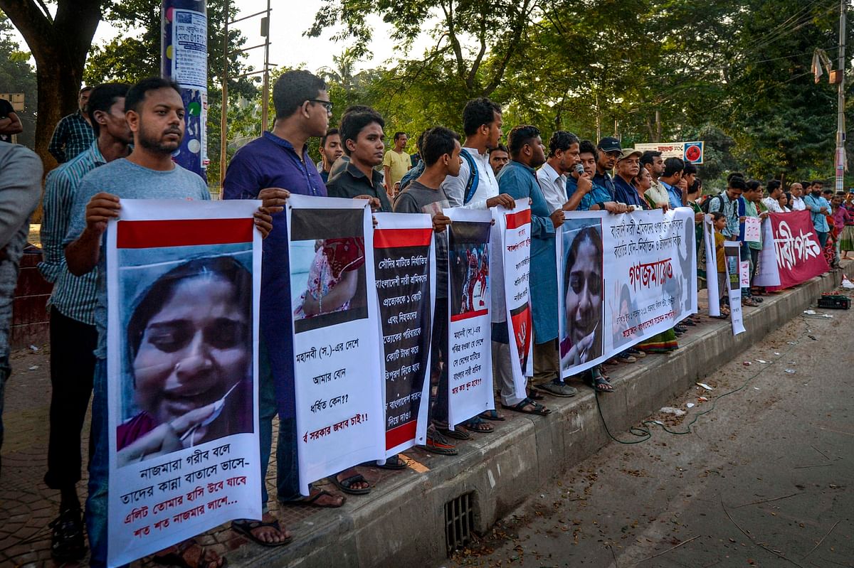 Social activists form a human chain to protest and raise awareness for Bangladeshi female migrant workers that can face various forms of abuse, including physical, psychological and even sexual abuse by employers in Saudi Arabia, near the Language Martyr Monument in Dhaka on 1 November 2019. Photo: AFP