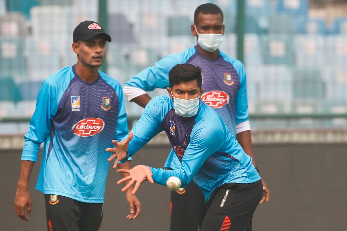 Bangladesh`s Soumya Sarkar wearing a face mask catches a ball during a practice session at Arun Jaitley Cricket Stadium in New Delhi on 1 November 2019, ahead of the first T20 international cricket match between Bangladesh and India. Photo: AFP
