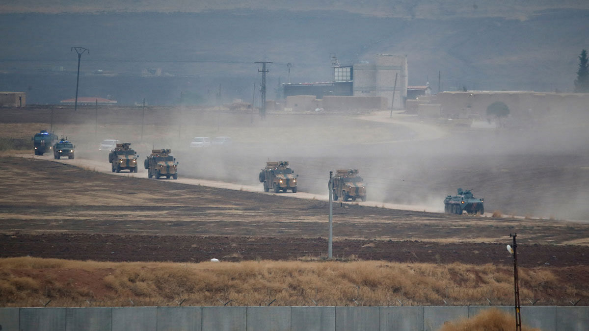 Turkish and Russian military vehicles return following a joint patrol in northeast Syria, as they are pictured from near the Turkish border town of Kiziltepe in Mardin province, Turkey, on 1 November 2019. Photo: Reuters