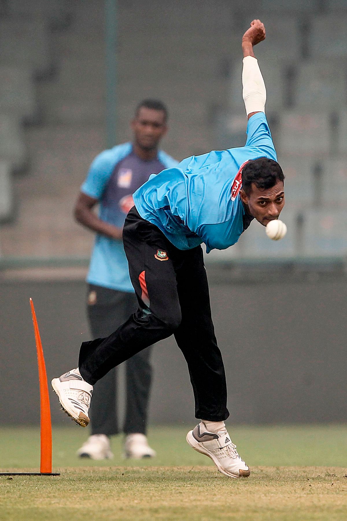 Bangladesh`s Shafiul Islam bowls during a practice session under heavy smog conditions at Arun Jaitley Cricket Stadium in New Delhi on 2 November 2019, ahead of the first T20 international cricket match of a three-match series between Bangladesh and India. Photo: AFP