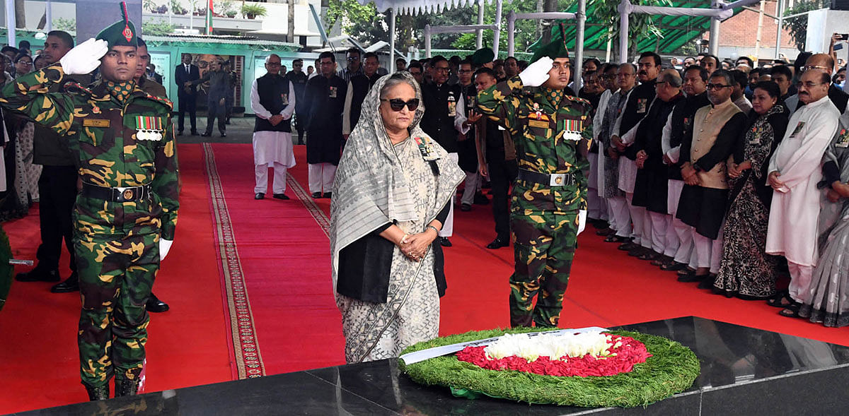 Prime minister Sheikh Hasina stands in solemn silence in front of the portrait father of the nation Bangabandhu Sheikh Mujibur Rahman at the Bangabandhu Memorial Museum in Dhanmondi, Dhaka on Sunday marking the Jail Killing Day. Photo: PID