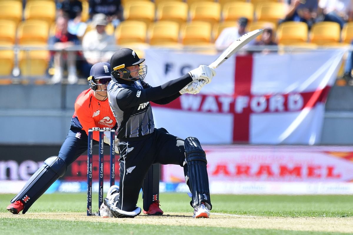 New Zealand`s Martin Guptill plays a shot in front of England`s wicket-keeper Sam Billings during the Twenty20 cricket match between New Zealand and England at Westpac Stadium in Wellington on 3 November 2019. Photo: AFP