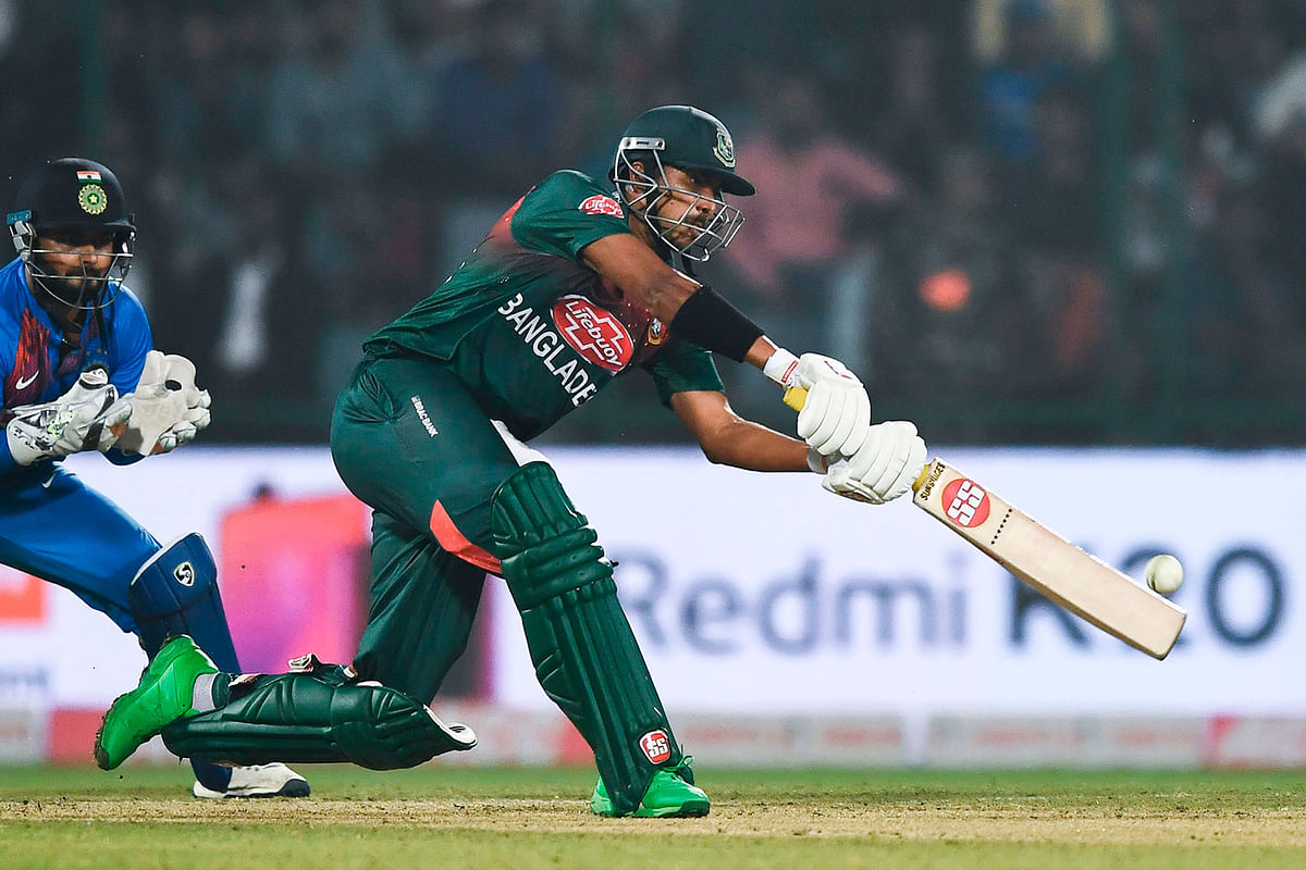 Bangladesh`s Soumya Sarkar (R) plays a shot during the first T20 international cricket match of a three-match series between Bangladesh and India, at Arun Jaitley Cricket Stadium in New Delhi on 3 November 2019. Photo: AFP