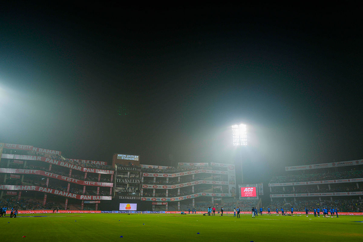 Indian cricketers warm up under smoggy conditions before the start of the first T20 international cricket match of a three-match series between Bangladesh and India, at Arun Jaitley Cricket Stadium in New Delhi on 3 November 2019. Photo: AFP