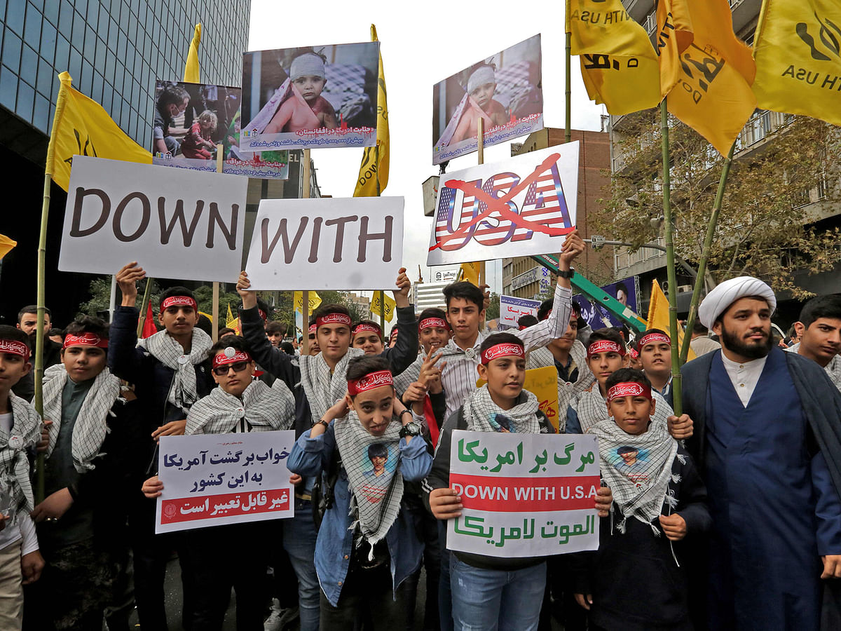 Iranian protesters hold anti-US placards during a rally outside the former US embassy in the Iranian capital Tehran on 4 November 2019, to mark the 40th anniversary of the Iran hostage crisis. Photo: AFP