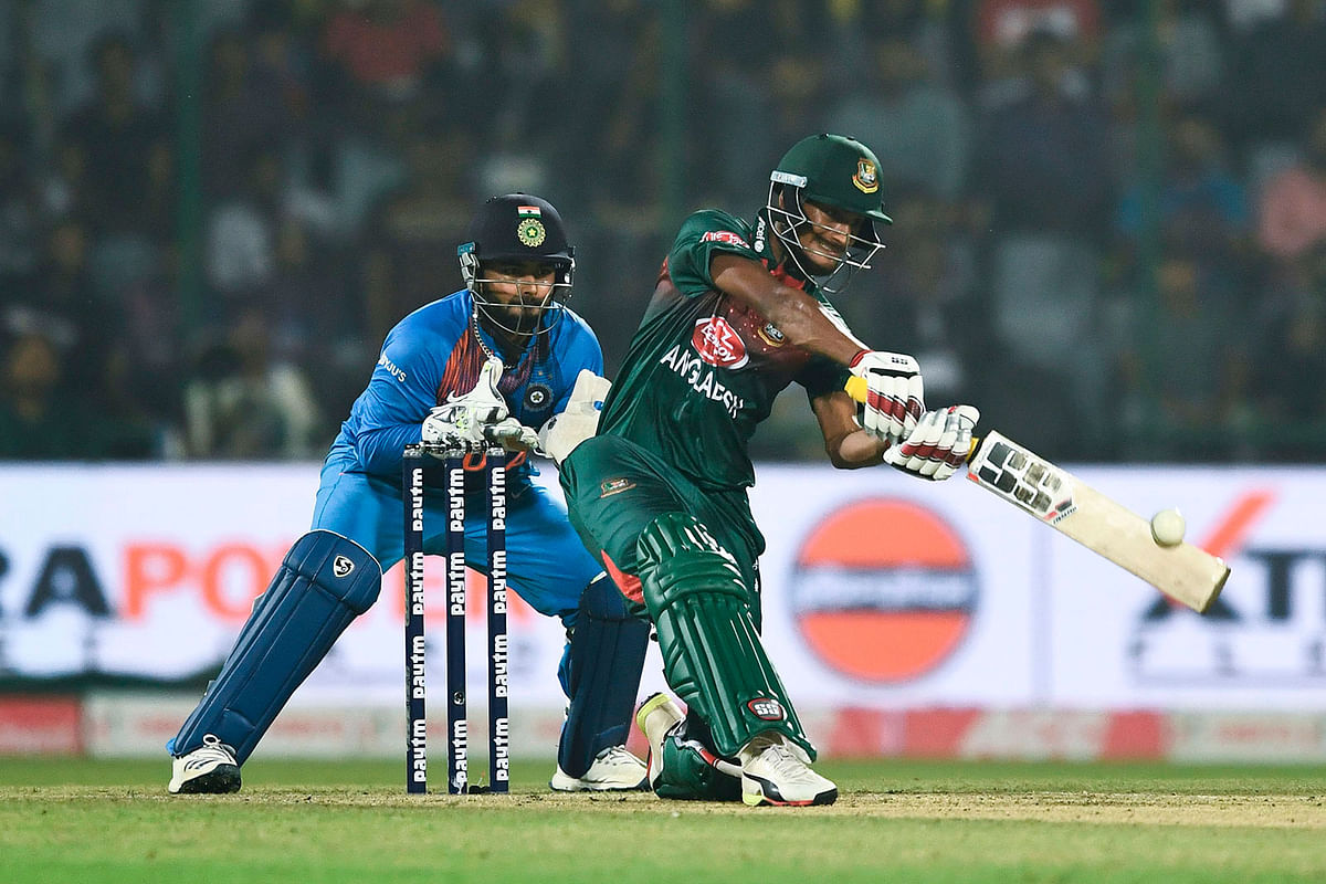 Bangladesh`s Naim Sheikh (R) plays a shot to be caught out during the first T20 international cricket match of a three-match series between Bangladesh and India, at Arun Jaitley Cricket Stadium in New Delhi on 3 November 2019. Photo: AFP