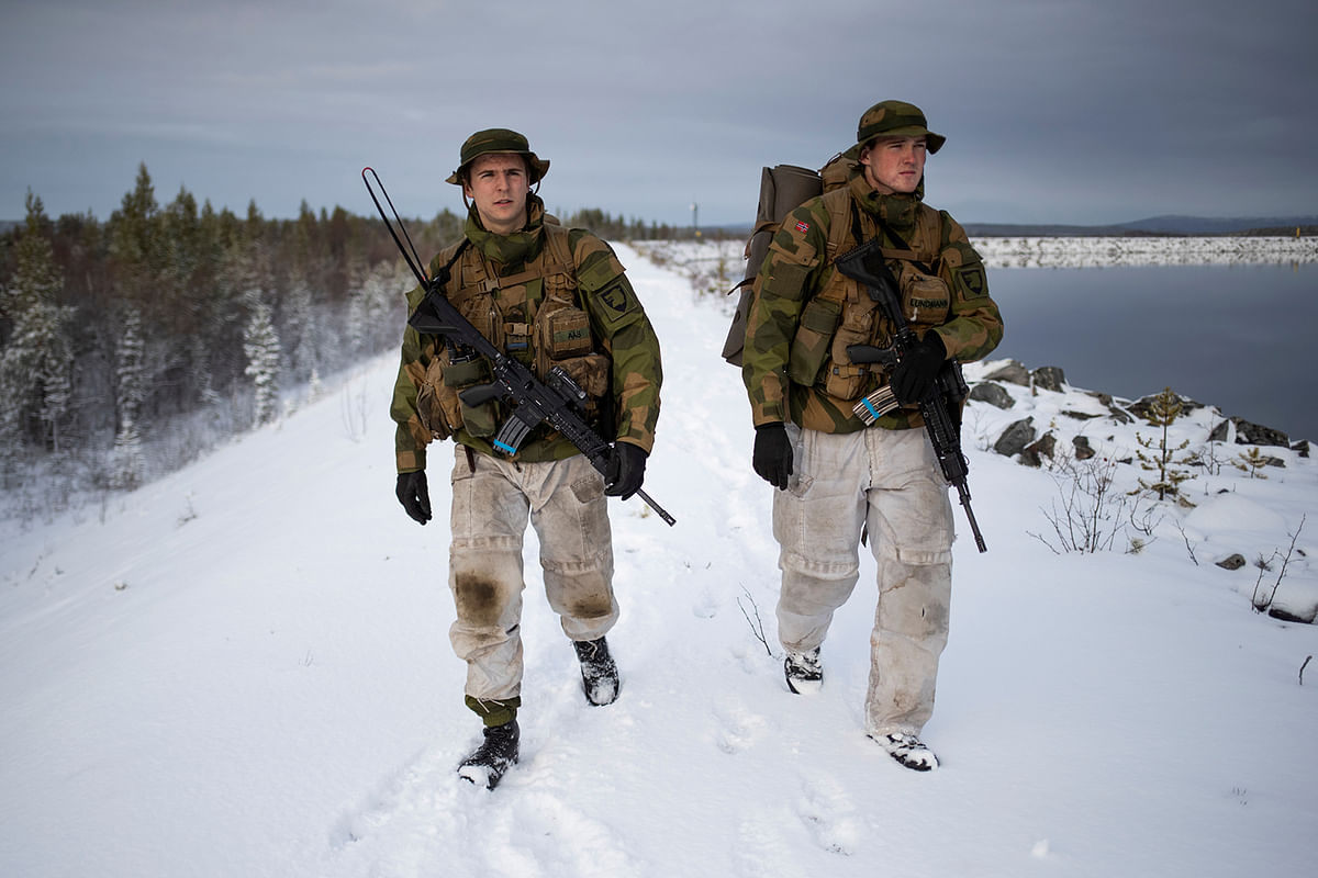 Patrol leader Joergen Aas (L) and radio operator Thomas Lundmann patrol the Norwegian side of the Norway-Russia border in Pasvik valley, Finnmark county, Norway on 23 October 2019. Photo: Reuters
