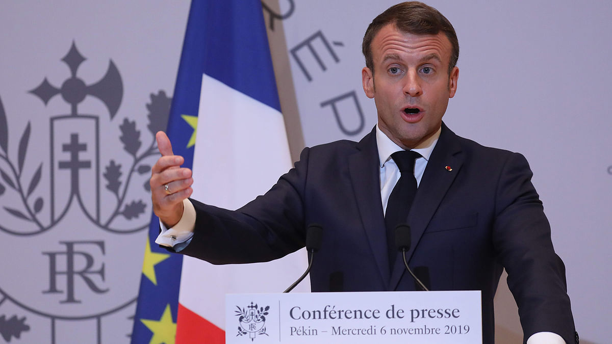 French President Emmanuel Macron holds a press conference at the French embassy at the end of his three days official visit in China, in Beijing on Wednesday. Photo: AFP