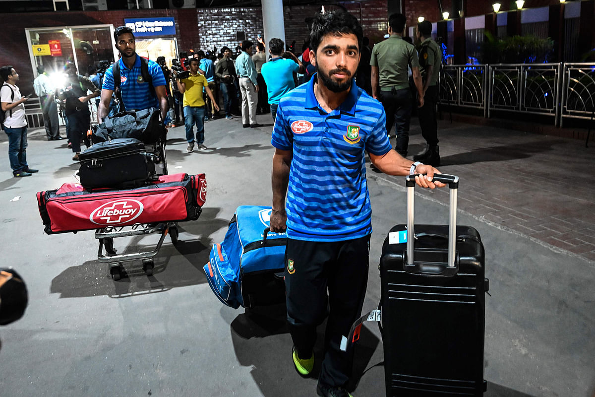 In this file photo taken on 16 March, 2019 Bangladesh cricketer Mominul Haque (R) is seen upon the team`s arrival from New Zealand in Dhaka, a day after narrowly escaping the mosque attack that killed 49 people in Christchurch. Photo: AFP