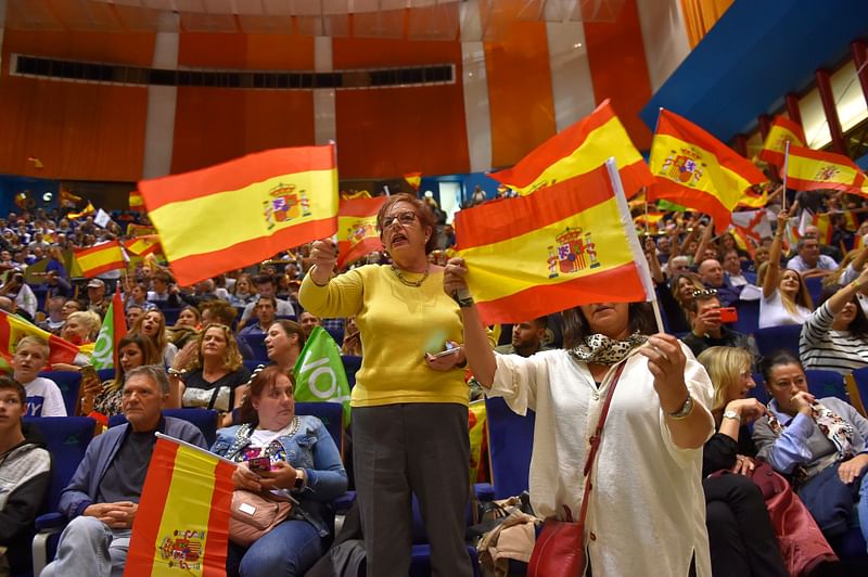 Spanish far-right Vox supporters wave Spanish flags during a campaign rally in Santander, on 1 November ahead of the 10 November general elections. Photo: AFP