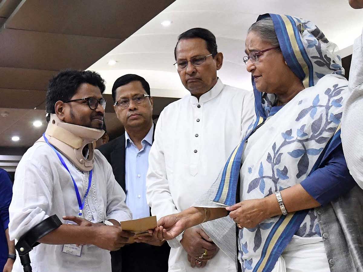 Prime minister Sheikh Hasina on Thursday distributes cheques of financial assistance at a ceremony at her office (PMO) among sick, financially insolvent and injured journalists as well as the families of journalists killed in road accidents. Photo: PID