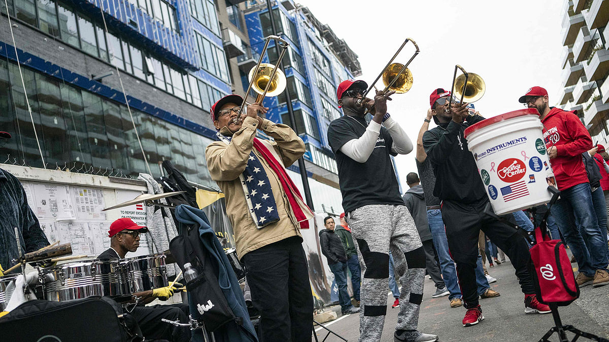 In this file photo taken on 26 October musicians play music as Washington Nationals fans arrive for game four of the 2019 World Series at Nationals Parkin Washington, DC. Photo: AFP
