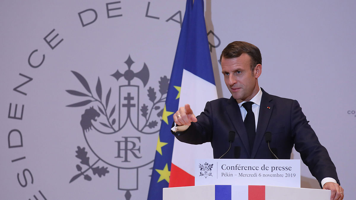 French President Emmanuel Macron holds a press conference at the French embassy at the end of his three days official visit in China, in Beijing on 6 November. Photo: AFP