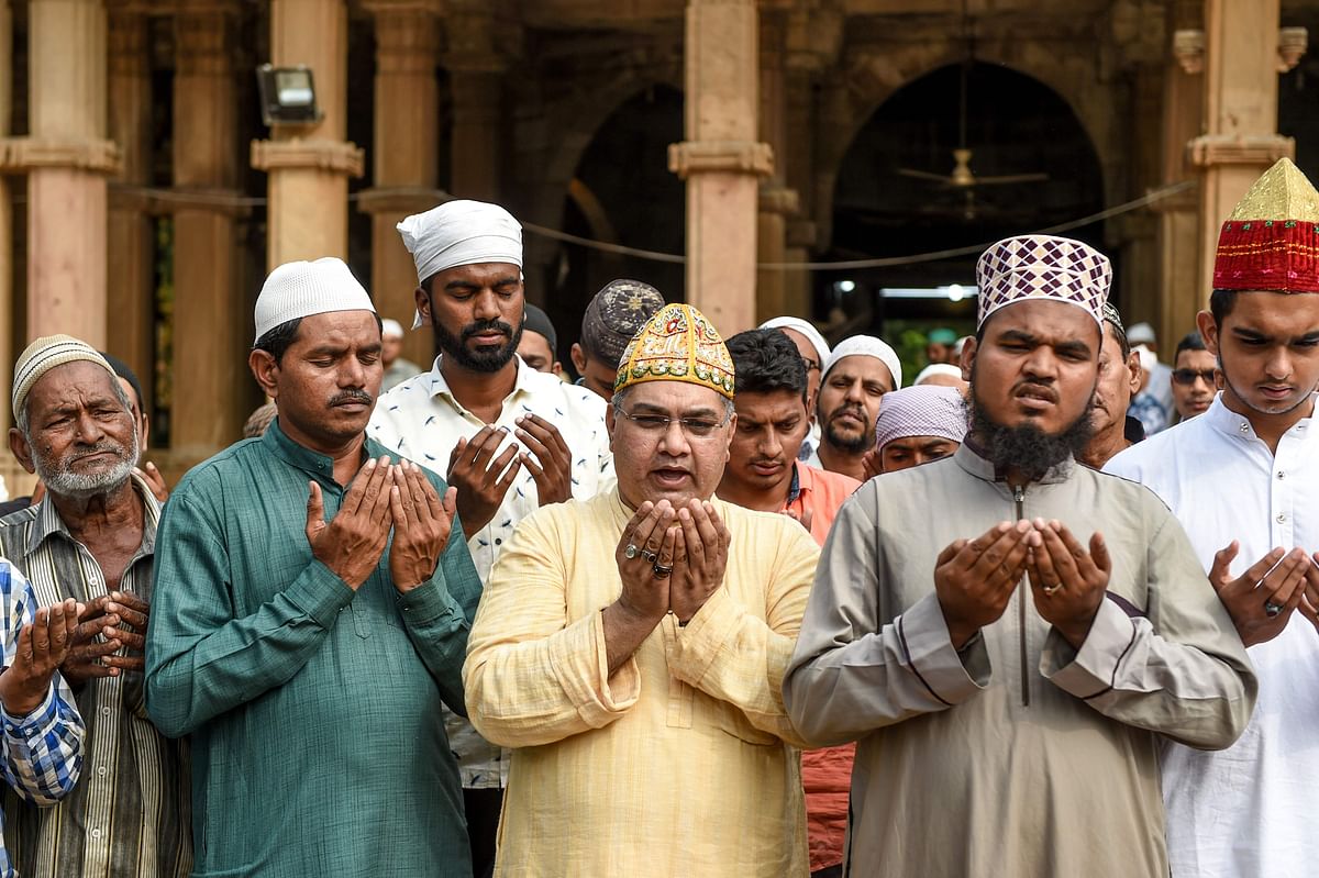 Muslims participate in a special prayer asking to maintain peace and harmony across India ahead of the court verdict of disputed religious site of Ayodhya, in the campus of ancient holy shrine of Hazrat Saiyed Usman Shamme Burhani in Ahmedabad on 8 November, 2019. Photo: AFP.