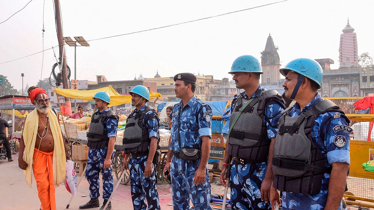 Security personnel stand guard on a street in Ayodhya on 7 November 2019, as part of a security measure ahead of a Supreme Court verdict on disputed 16th-century Babri mosque. Photo: AFP