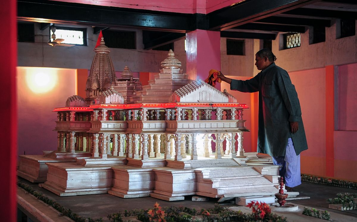In this file photo taken on 13 March 2014 a worker cleans a model of a proposed Hindu temple in Ayodhya. Photo: AFP