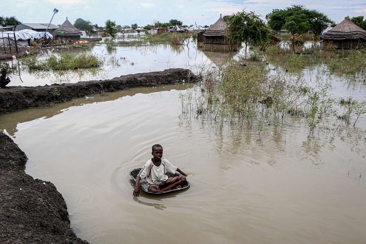A South Sudanese boy plays in flooded area that has been isolated for about a month and half due to the heavy rain in Pibor Town, Boma state, eastern South Sudan, on 6 November 2019. Photo: AFP