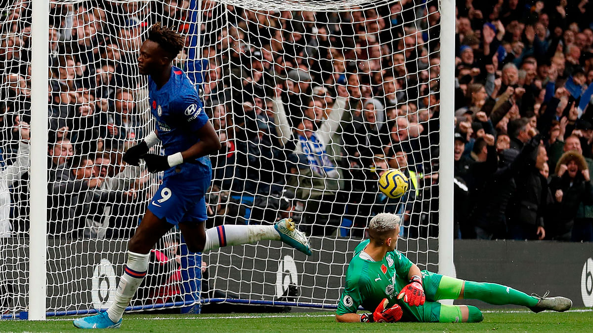 Chelsea`s English striker Tammy Abraham scores his team`s first goal during the English Premier League football match between Chelsea and Crystal Palace at Stamford Bridge in London on Saturday. Photo: AFP