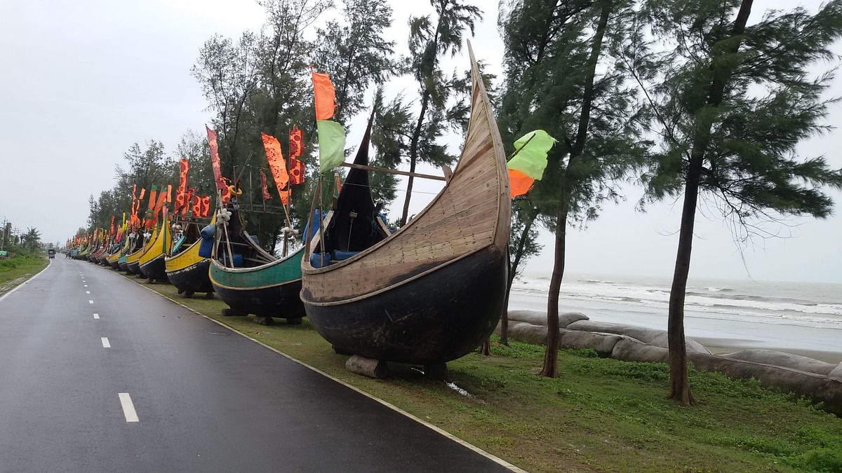 Vessels removed from the sea due to cyclone Bulbul are arranged on the road at Teknaf, Cox`s Bazar on 9 November 2019. Photo: Giyas Uddin