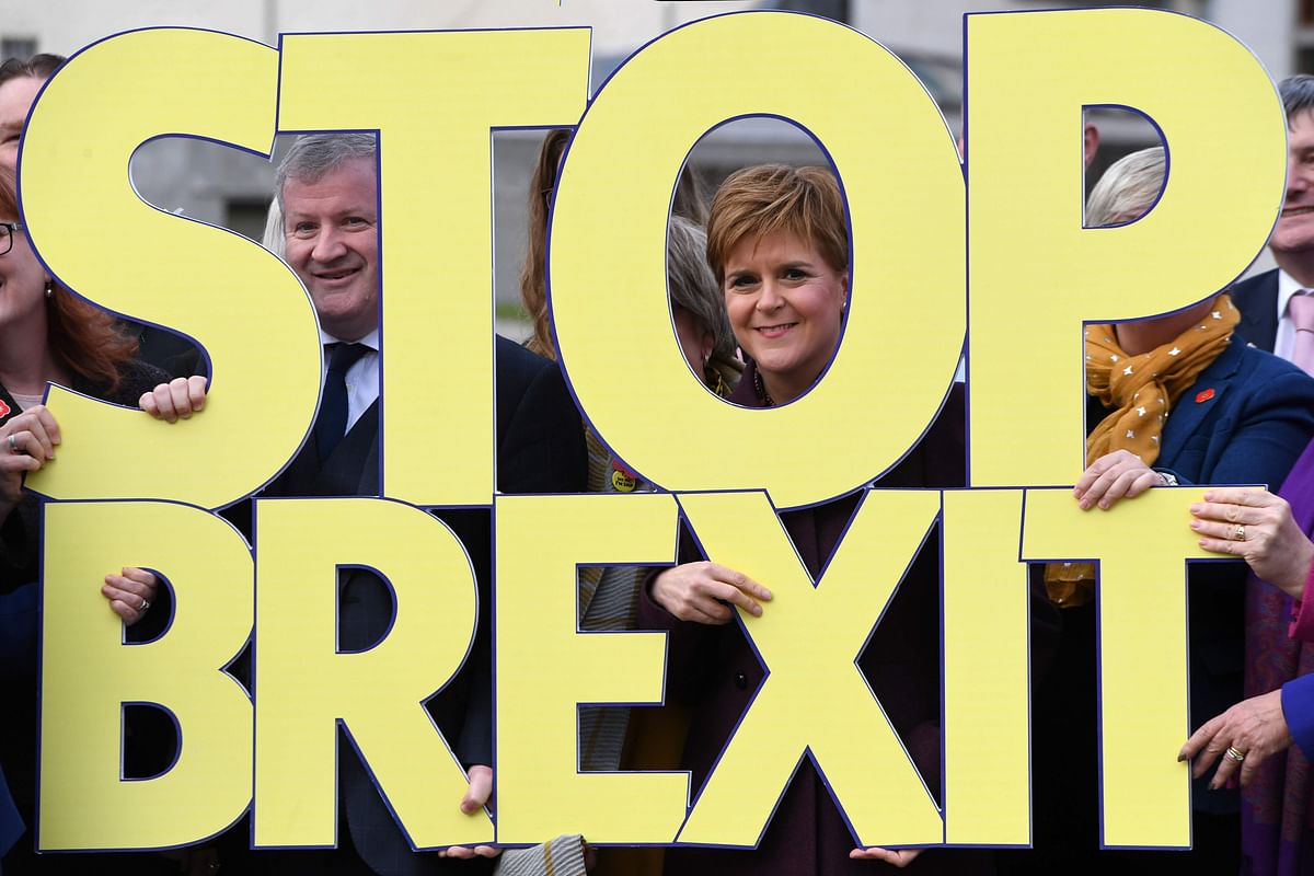 Scottish Nationalist Party (SNP) leader, and Scotland`s First Minister, Nicola Sturgeon (C), poses with party members and a `Stop Brexit` sign to launch the party`s general election campaign in Edinburgh, Scotland on November 8, 2019. Britain goes to the polls on December 12 to vote in a pre-Christmas general election. Photo: AFP