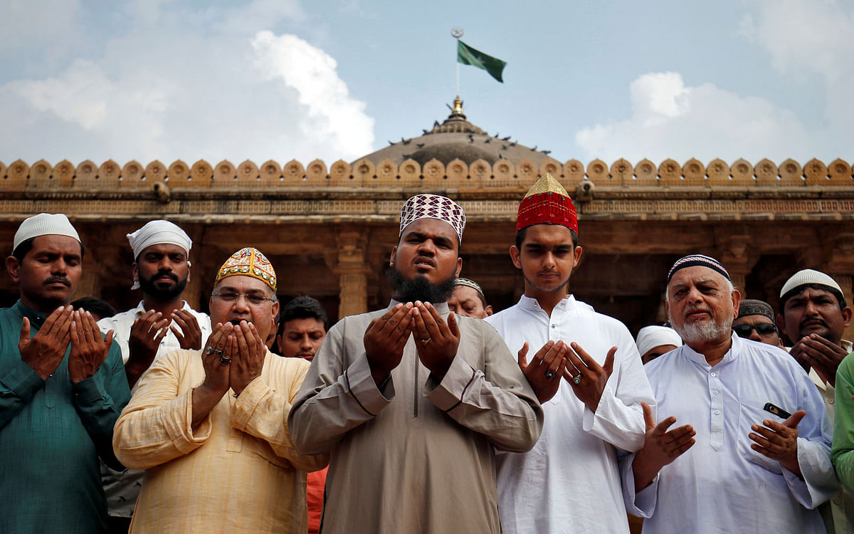 Muslims pray for peace ahead of verdict on a disputed religious site in Ayodhya, inside a mosque premises in Ahmedabad, India, on 8 November 2019. Photo: Reuters