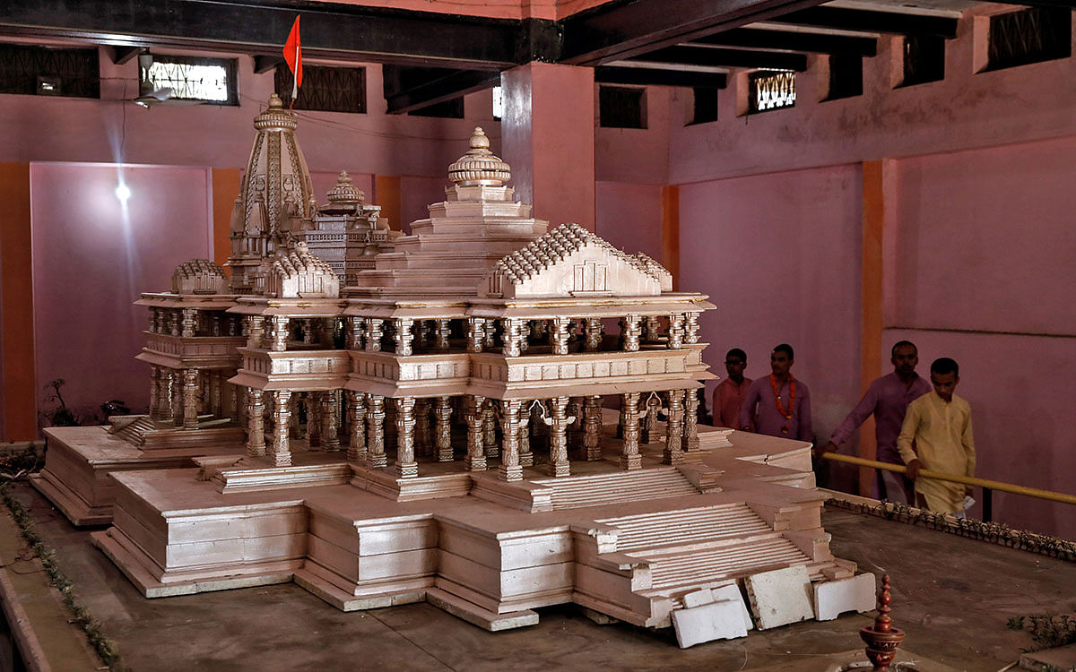 Devotees look at a model of the proposed Ram temple that Hindu groups want to build at a disputed religious site in Ayodhya, India, on 22 October 2019. Photo: Reuters