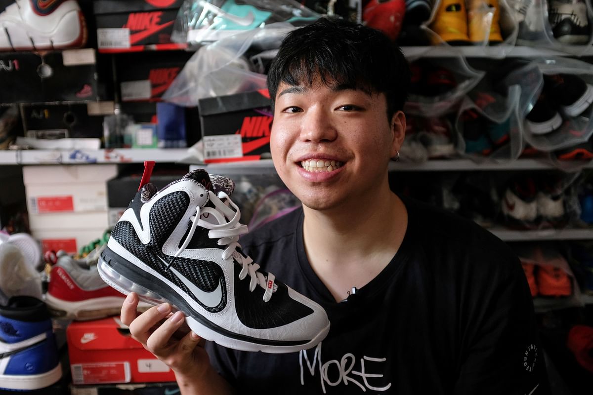His photo taken on 15 September 2019 shows sneaker and trainer collector Wang Yue showing off his collection in his home in Shanghai. Photo: AFP