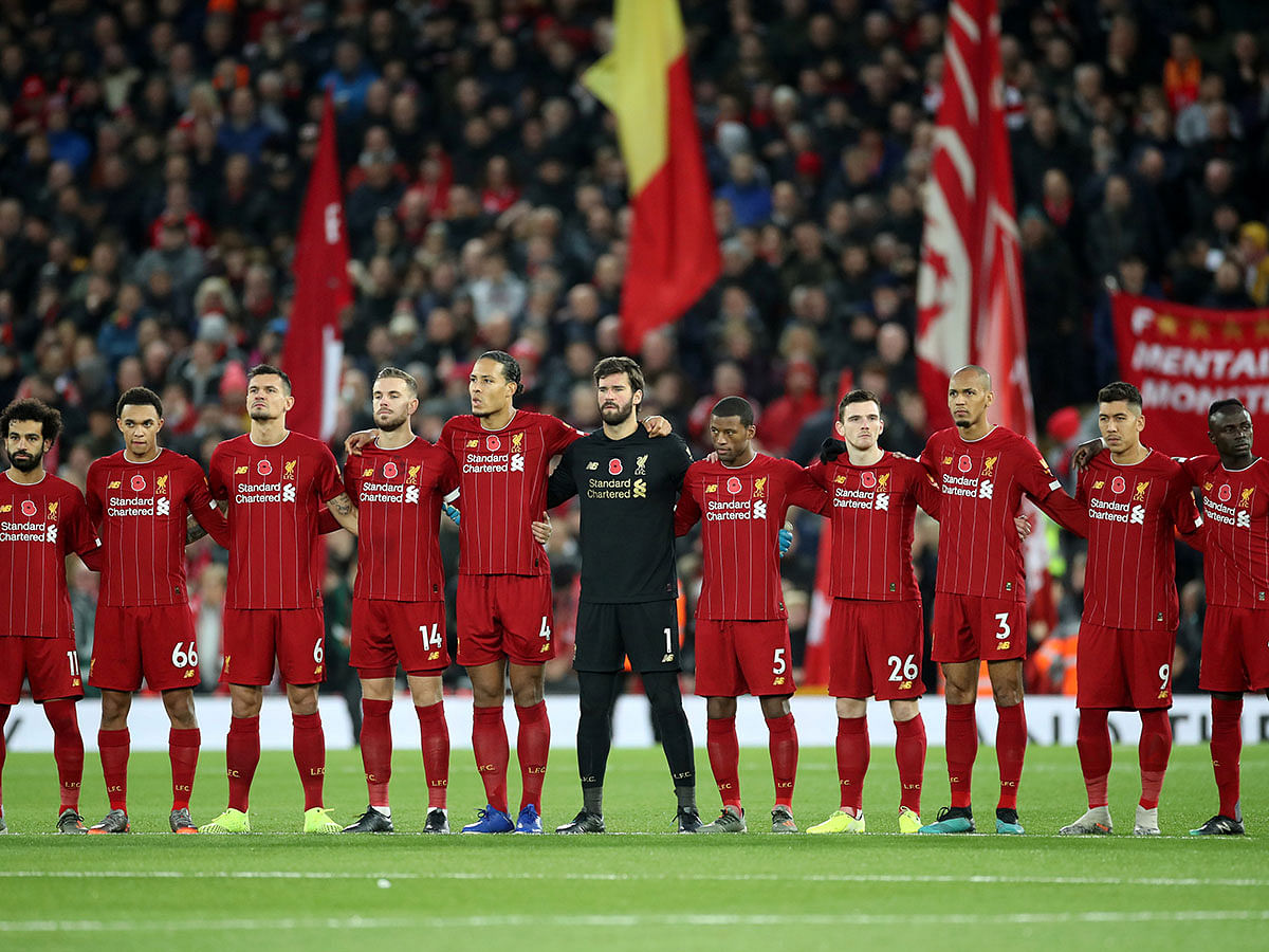 Liverpool players during a minutes silence as part of remembrance commemorations before the match against Man City. Photo; Reuters