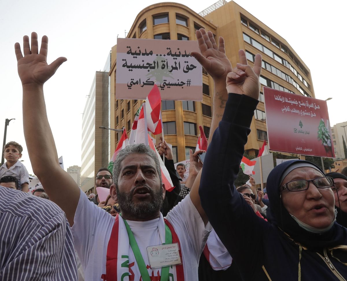 Lebanese demonstrators gesture during a march entitled `My Nationality, My Dignity` in the centre of the capital Beirut on 10 November 2019, calling for giving Lebanese women the right to transmit the nationality to their children. Photo: AFP