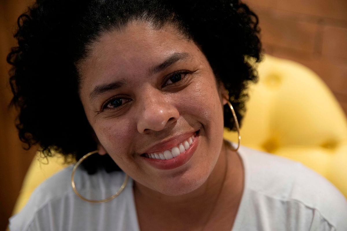 Ana Claudia, 37, smiles as she poses for pictures during an interview with AFP in Rio de Janeiro, Brazil, on 9 September 2019. Photo: AFP