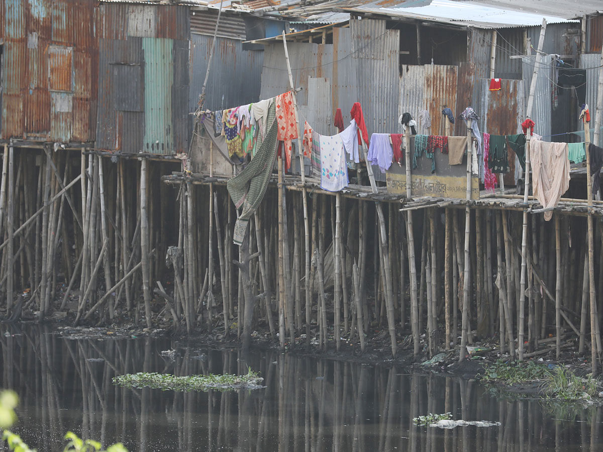 Bamboo and tin shade structures built encroaching Kalunagar canal of river Buriganga in Kamrangirchar, Dhaka on 11 November 2019. Photo: Abdus Salam