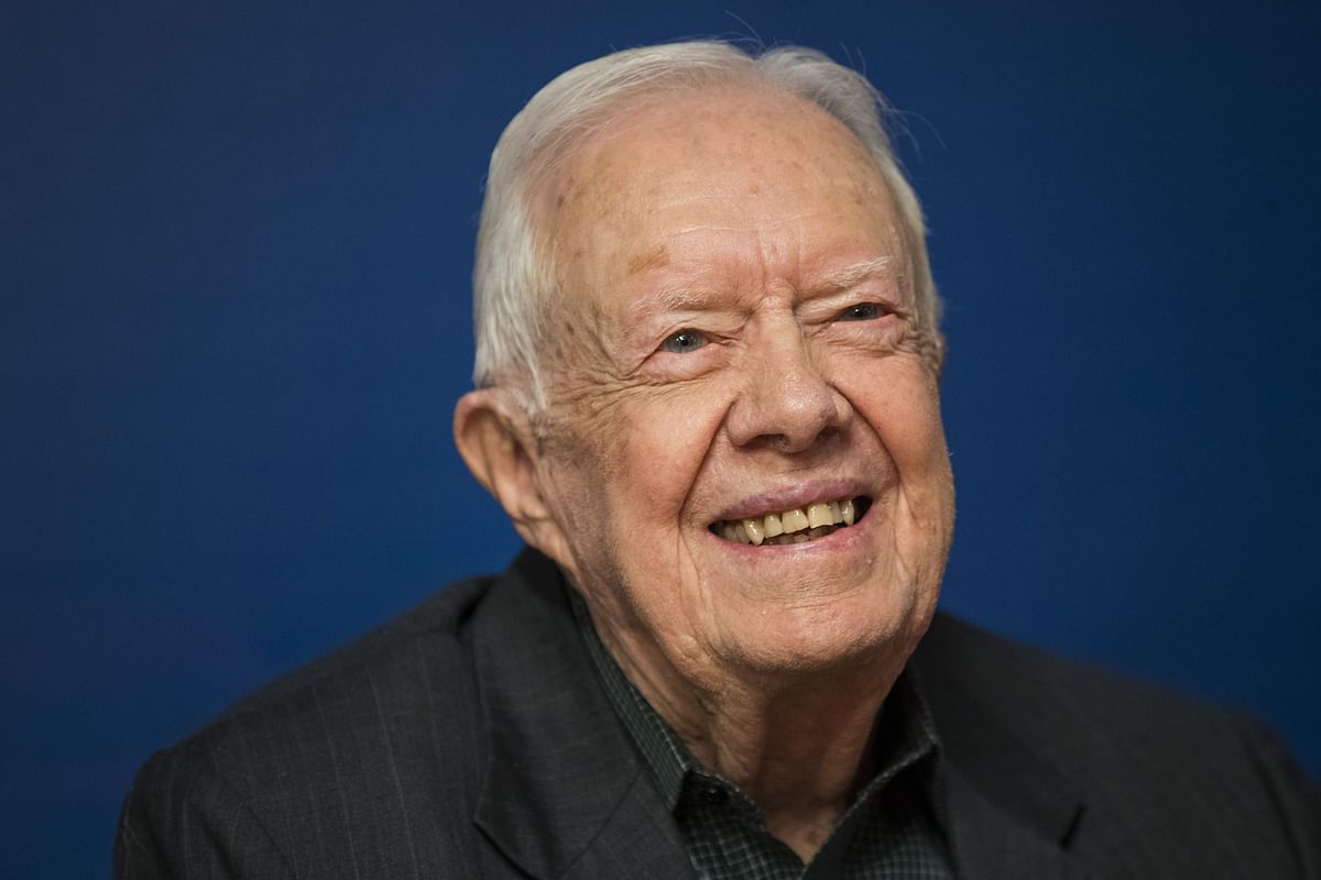 In this file photo Former US president Jimmy Carter smiles during a book signing event for his new book `Faith: A Journey For All` at Barnes & Noble bookstore in Midtown Manhattan on 26 March 2018 in New York City. Photo: AFP