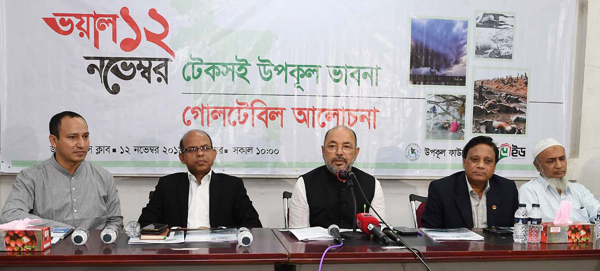 State minister for disaster management and relief Md Enamur(M) Rahman addresses a roundtable titled ‘Grisly 12 November: Sustainable Coastal Thinking,’ jointly organised by Coast Foundation and EduAid at the National Press Club, Dhaka on Tuesday. Photo: PID