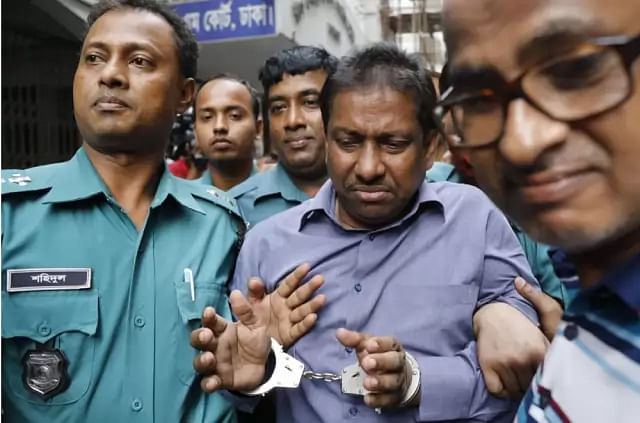 Handcuffed Kalabagan Krira Chakra Club president Shafiqul Alam Feroz. Prothom Alo File Photo