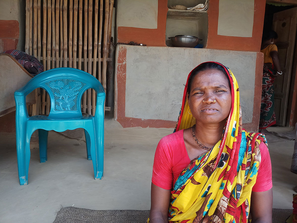 Oraon minority woman Kalamoti Kujur sits at home after losing her job as landowners turn rice fields into mango orchards in Naogaon district, Bangladesh, on 21 September 2019. Photo: Thomson Reuters Foundation