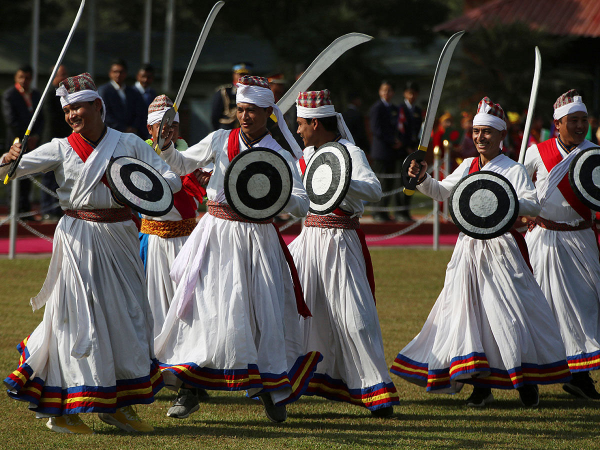 Nepalese dancer with traditional attire performs while welcoming President of Bangladesh Abdul Hamid at Tribhuwan International Airport in Kathmandu, Nepal on 12 November 2019. Photo: Reuters