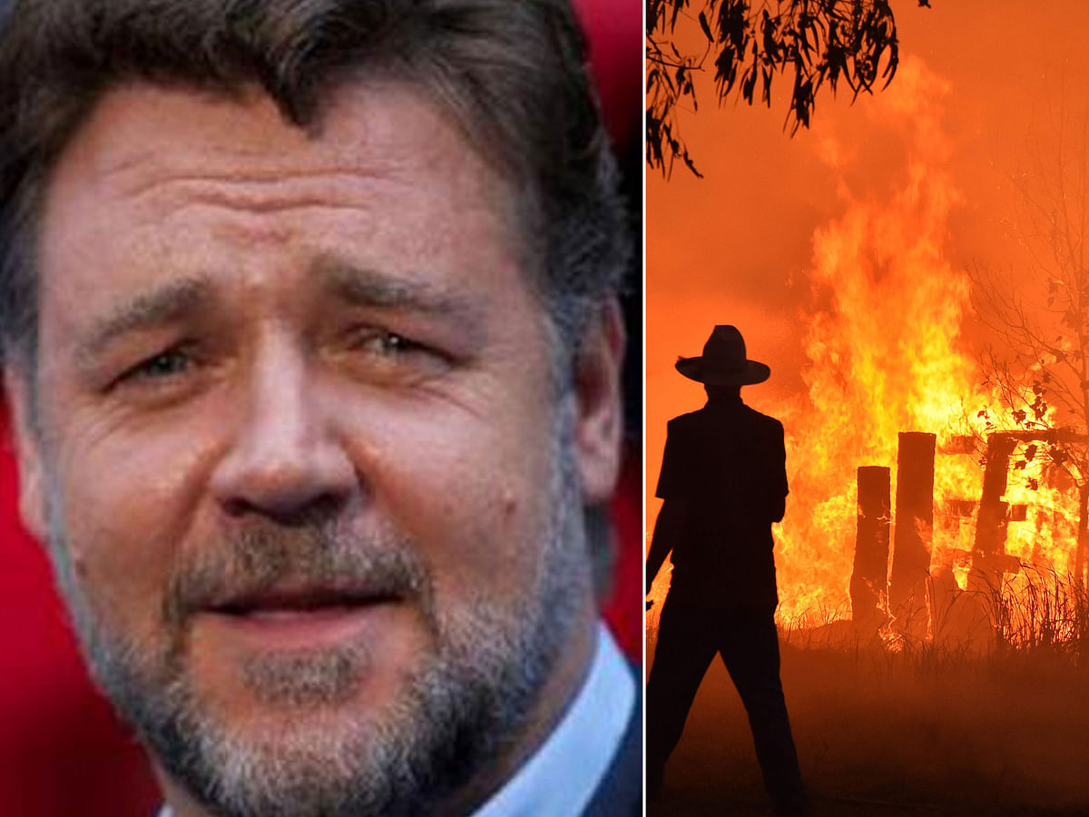 Russell Crowe and residents defend a property from a bushfire at Hillsville near Taree. AFP file photos