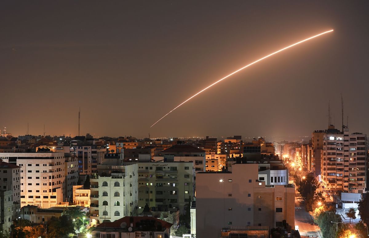 Israeli missile launched from the Iron Dome defence missile system, designed to intercept and destroy incoming short-range rockets and artillery shells, is seen above Gaza city on 12 November. Photo: AFP